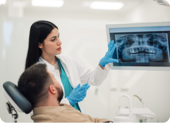 Dentist showing digital x-rays to a patient